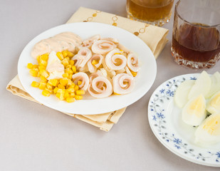 Squid salad with egg, onion, corn and sauce
