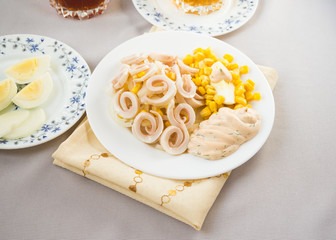 Squid salad with egg, onion, corn and sauce