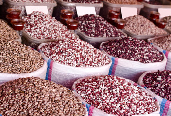 Beans on the market in  bags.