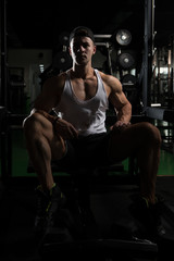Fototapeta na wymiar Guy Resting In Healthy Club Gym
