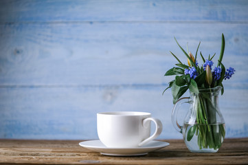 Coffee and a bowl with spring flowers