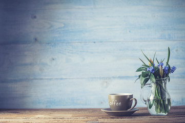 Coffee and a bowl with spring flowers