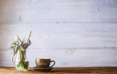 Coffee and a bowl with spring flowers