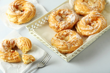 Sweet and tasty eclairs on a white background