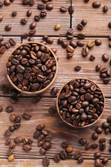 Roasted coffee beans on a brown wooden table