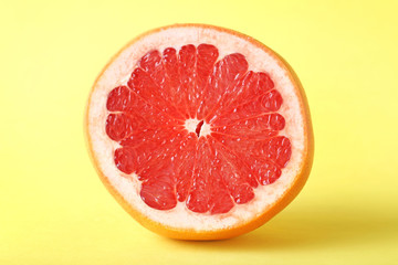 Sweet grapefruit fruit on a yellow background