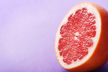 Sweet grapefruit fruit on a purple background