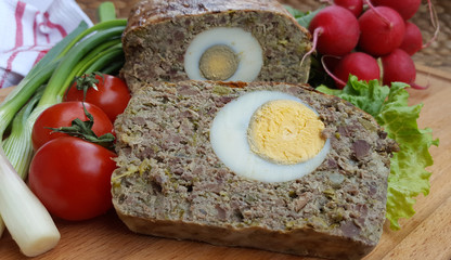Baked meatloaf with boiled eggs