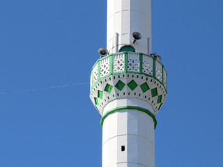 Ornamented balcony and speakers on the minaret of the Turkish mosque