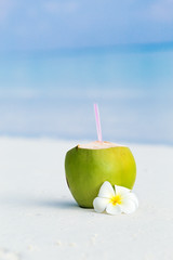 Fresh coconut juice decorated tropical plumeria flower