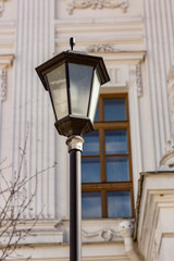 Fototapeta na wymiar Vintage black lantern on a city street 