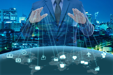businessman in blue suite control the world , internet of things concept