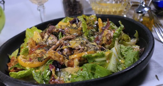 Dolly panning view of a delicious Caesar's salad