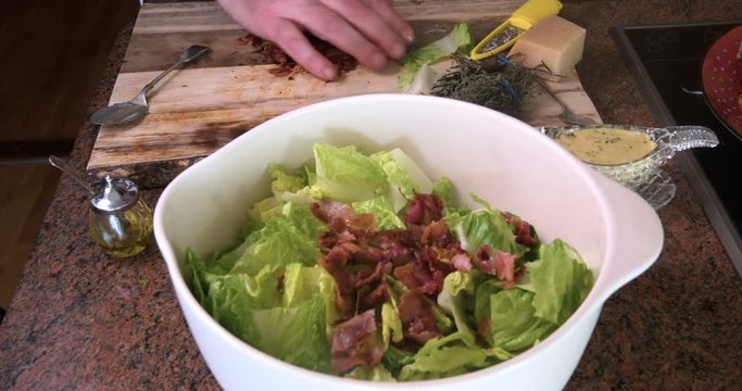 Timelapse view of the preparation of a delicious Caesar's salad