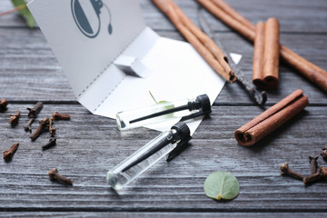 Beautiful composition with perfume samples on wooden background