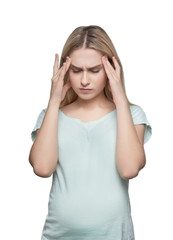 Young pregnant woman suffering from headache on white background