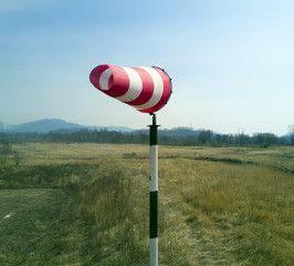 Red-white windsock indicating wind