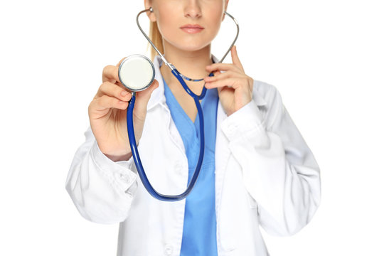Female doctor with stethoscope on white background, closeup