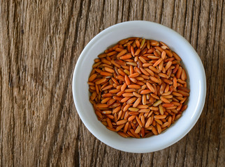 Brown rice seed in bowl. Top view.