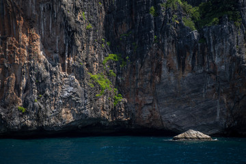 Cliff and the clear sea Phi Phi islands south of Thailand. Phi phi high rocks islands.