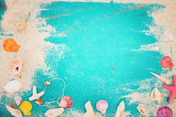 Summer background - starfish, shells, coral on wood table background.  vintage color tone styles.