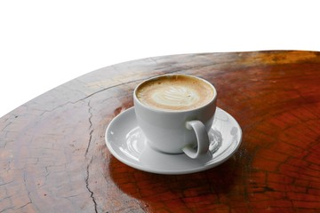 coffee cappuccino in wood floor close up on white background