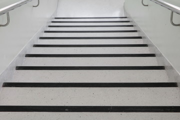 terrazzo floor stairs walkway down. select focus with shallow depth of field.