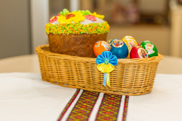 Fototapeta na wymiar Easter eggs and Easter cakes (or paskhas) are the traditional symbols of the religious holiday. Paskha is a traditional dessert served in Ukraine as well as other Eastern European countries. April 20