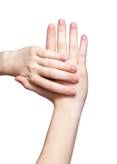 Poster Female hands with woman's professional natursl pink nails manicure on white © Serg Zastavkin