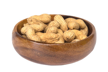 Dried peanuts in wooden bowl isolated on white background.