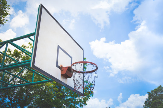 Basketball hoop on the blue sky