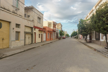 Fototapeta na wymiar CIENFUEGOS, CUBA - DECEMBER 31, 2016: Street view
