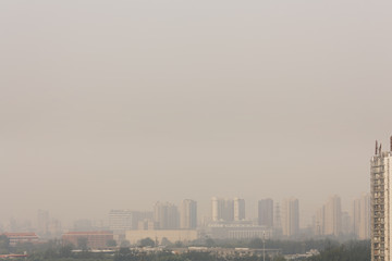 Wide angle horizontal  shot of  buildings in beijing on a foggy day