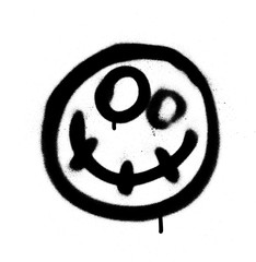 Graffiti scary happy emoji sprayed in black on white