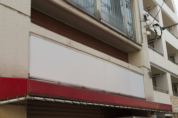 Fototapeta premium Street, Banner - Sign, Lighting Equipment, Billboard, Advertisement,Large blank billboard on a street wall, banners with room to add your own text