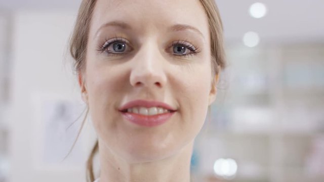  Optician puts a pair of glasses on a patient, as seen from patient's pov.