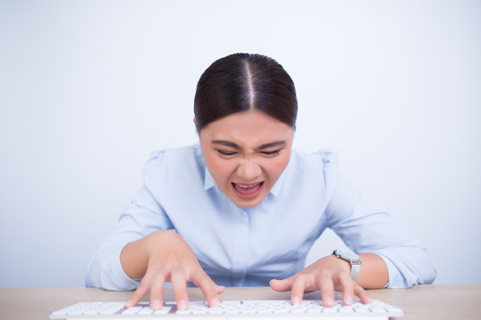 Crazy woman with hands on keyboard