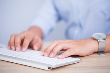 Female hands typing on the keyboard