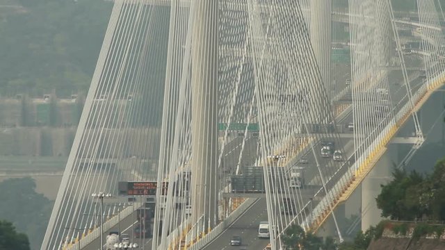 Span suspension bridge traffic - Hong Kong.