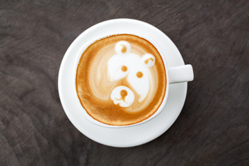 A cup of coffee latte art like bear face