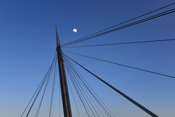 Fototapeta na wymiar Pescara, Italy - The Ponte del Mare bridge at the dusk, in the canal and port of Pescara city, Abruzzo region