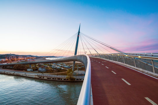 Pescara, Italy - The Ponte del Mare bridge at the dusk, in the canal and port of Pescara city, Abruzzo region