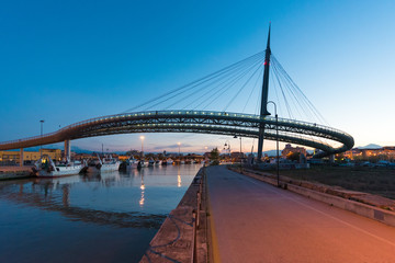 Pescara, Italy - The Ponte del Mare bridge at the dusk, in the canal and port of Pescara city,...