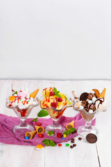 Three ice creams in glass cups