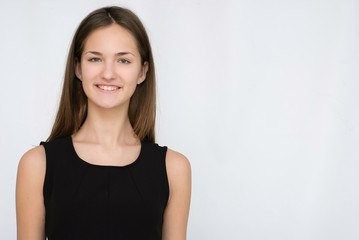 Fototapeta premium young business lady in black dress isolated