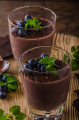 Chocolate pudding with berries and herbs