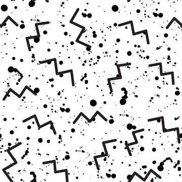 Geometric abstract seamless pattern in the style of Memphis. Fashionable black and white zigzags and paint splatters on a white background. Trend of the 80s, 90s. Modern print. Funky background.