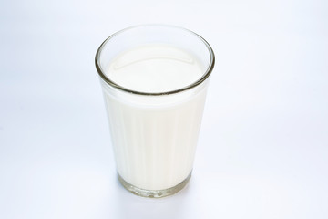 A glass of milk on white background isolated