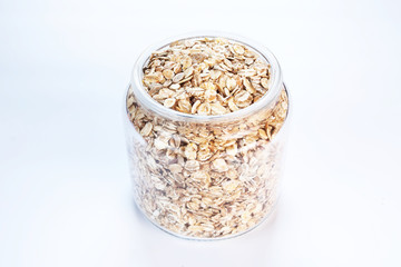 A jar with oats on white background isolated