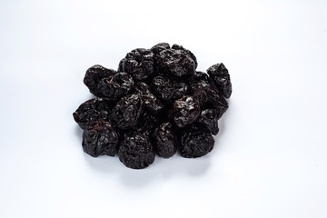 A dried plum on white background isolated